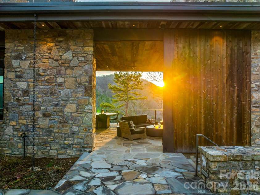 112 Moon Shadow Lane, Marshall, NC 28753.  MLS# CAR4332984, YatesRealty ID 2969. Covered/screened porch has sliding barn door for easy entertaining!