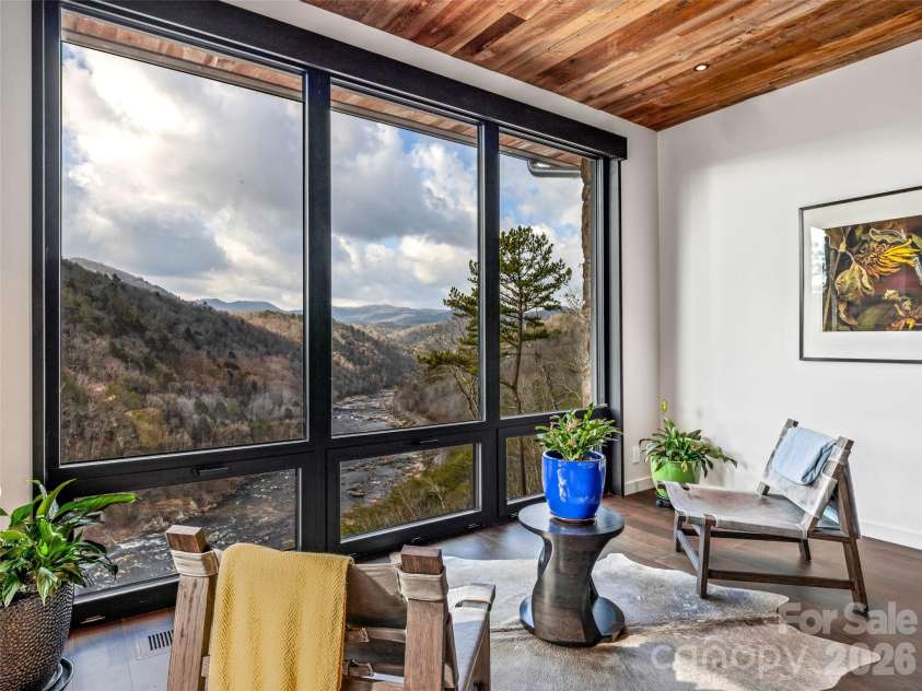 112 Moon Shadow Lane, Marshall, NC 28753.  MLS# CAR4332984, YatesRealty ID 2969. Sitting area in primary suite to unwind and take in the views.