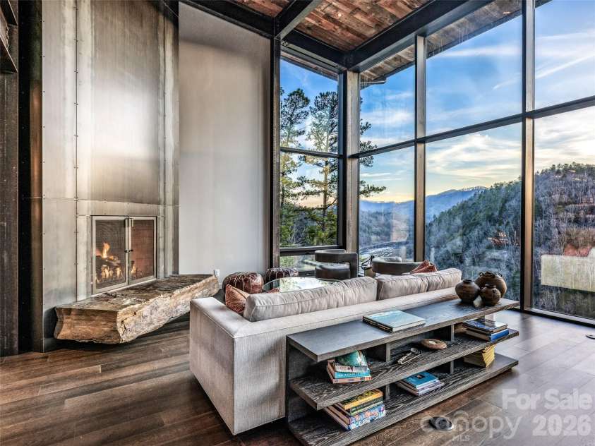 112 Moon Shadow Lane, Marshall, NC 28753.  MLS# CAR4332984, YatesRealty ID 2969. Steel surround gas fireplace with the rock slab base invites comfort and warmth.