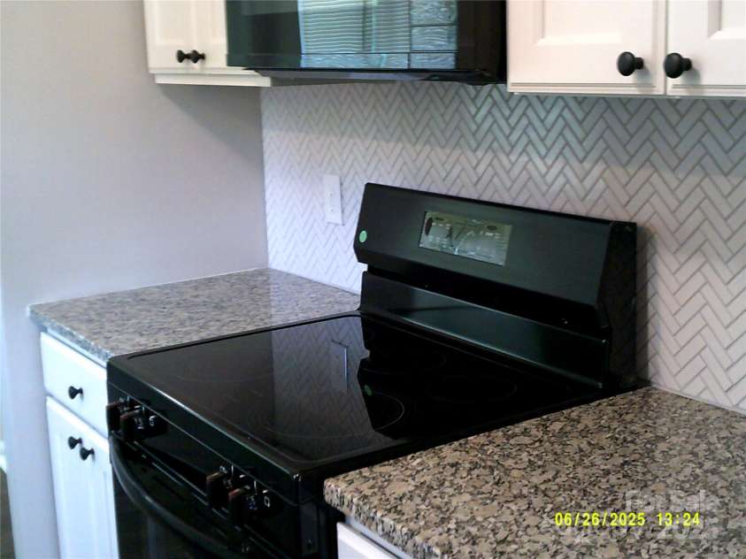 5855 Amity Springs Drive, Charlotte, NC 28212.  MLS# CAR4275097, YatesRealty ID 29690. Kitchen with new cabinets and granite