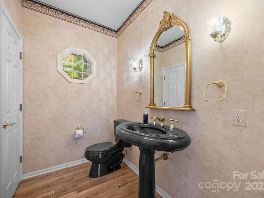 110 Thrashing Rock Drive, Hendersonville, NC 28739.  MLS# CAR4282429, YatesRealty ID 29693. Upstairs half bath for guests