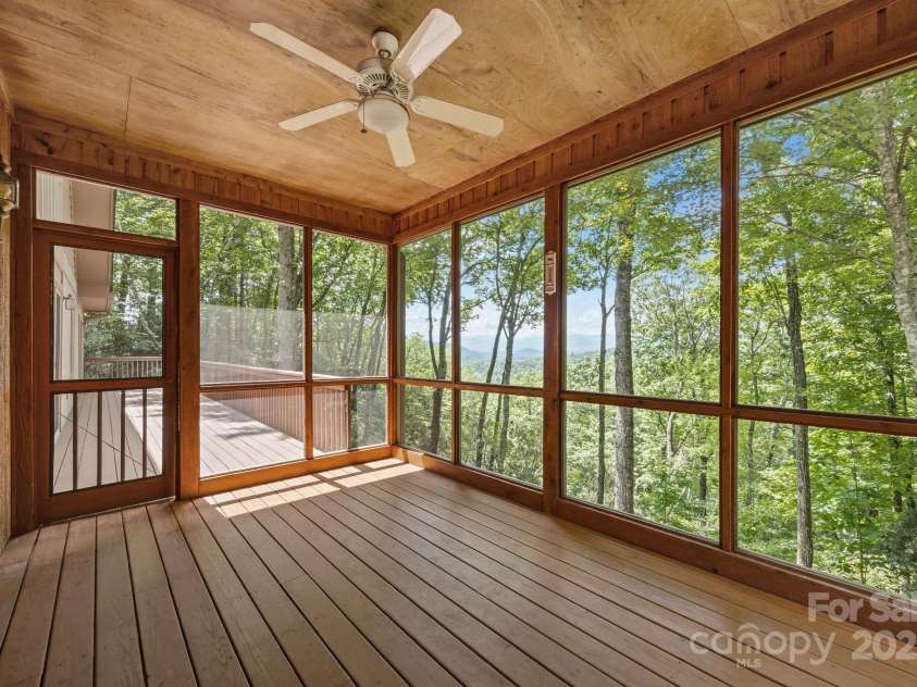 110 Thrashing Rock Drive, Hendersonville, NC 28739.  MLS# CAR4282429, YatesRealty ID 29693. Upstairs screened in porch