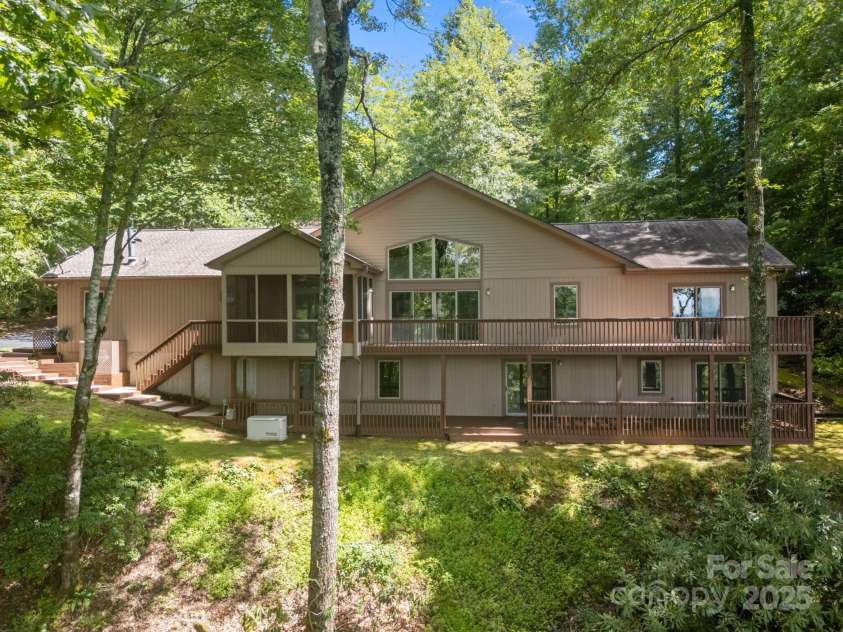 110 Thrashing Rock Drive, Hendersonville, NC 28739.  MLS# CAR4282429, YatesRealty ID 29693. View of the back of the house and 2 amazing decks!