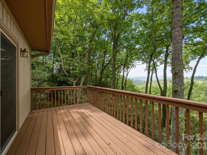 110 Thrashing Rock Drive, Hendersonville, NC 28739.  MLS# CAR4282429, YatesRealty ID 29693. Walk onto the back deck from the main living area