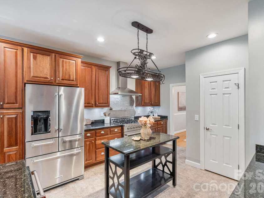 182 Broadview Circle, Mooresville, NC 28117.  MLS# CAR4352412, YatesRealty ID 29701. Ample kitchen cabinets and walk-in pantry