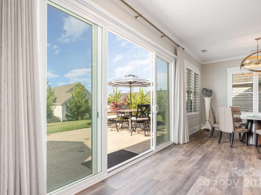 21016 Molly Harper Drive, Cornelius, NC 28031.  MLS# CAR4320388, YatesRealty ID 29705. From the great room, step out onto your large patio space, perfect for entertaining