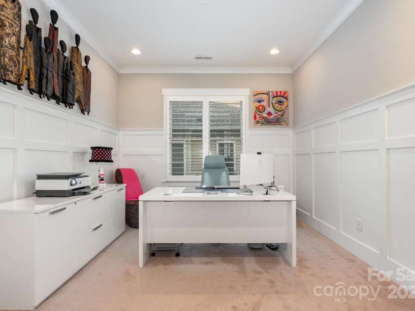 21016 Molly Harper Drive, Cornelius, NC 28031.  MLS# CAR4320388, YatesRealty ID 29705. Main floor study with glass french doors and custom millwork including wainscot and crown molding