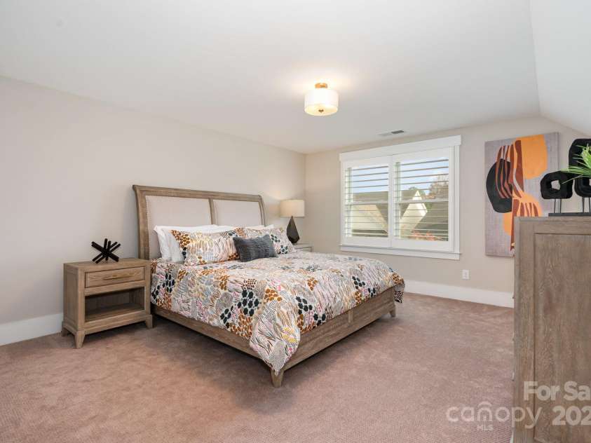 21016 Molly Harper Drive, Cornelius, NC 28031.  MLS# CAR4320388, YatesRealty ID 29705. Upper guest suite is also thoughtfully placed with plenty of space, a large closet and a tucked away feeling from the hustle and bustle