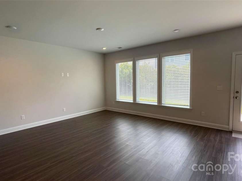 7037 Messina Road, Fort Mill, SC 29707.  MLS# CAR4286750, YatesRealty ID 29706. Family area with door out to back patio