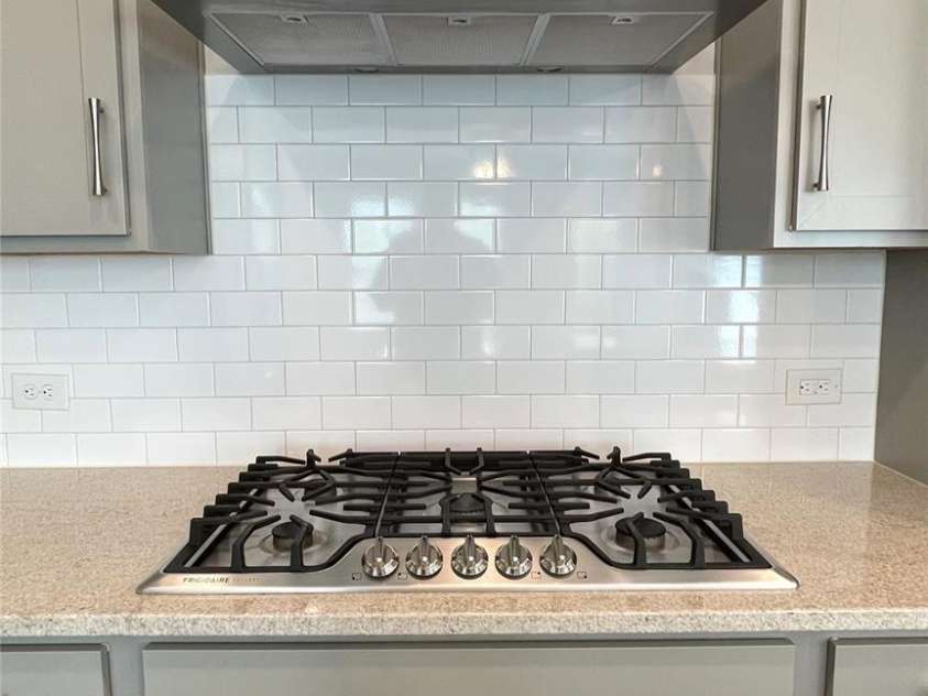 7037 Messina Road, Fort Mill, SC 29707.  MLS# CAR4286750, YatesRealty ID 29706. Gas cooktop and hood