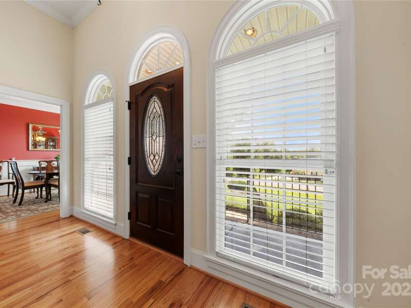 1012 Catawba Shores Drive, Rock Hill, SC 29730.  MLS# CAR4280757, YatesRealty ID 29723. Tall ceilings and arched windows along with site finished hardwood floors make the space airy and bright