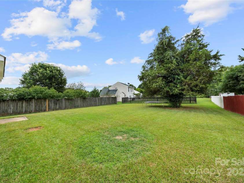 4033 Lakota Court, Charlotte, NC 28269.  MLS# CAR4286797, YatesRealty ID 29733. Large flat backyard