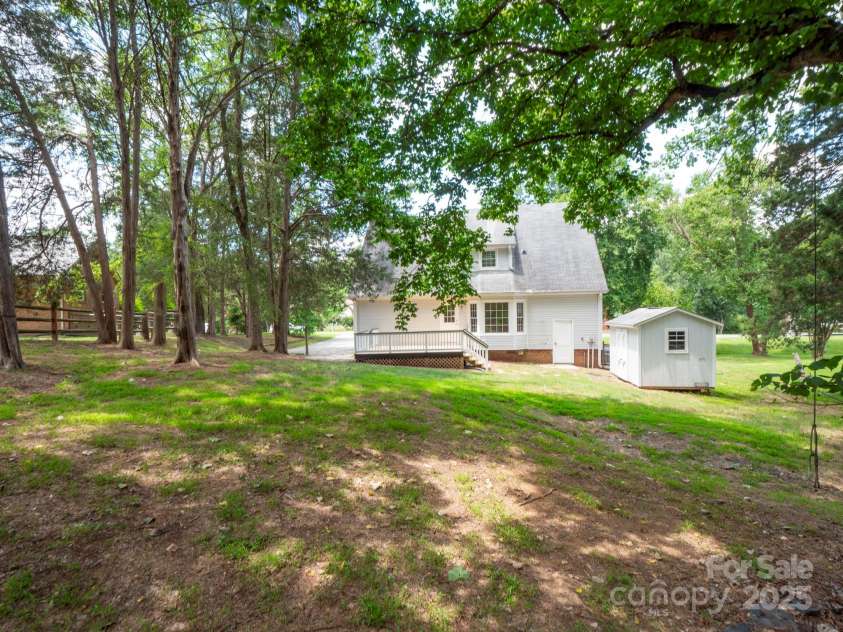 8301 Tifton Road, Charlotte, NC 28226.  MLS# CAR4275465, YatesRealty ID 29738. Beautiful lot with mature landscape
