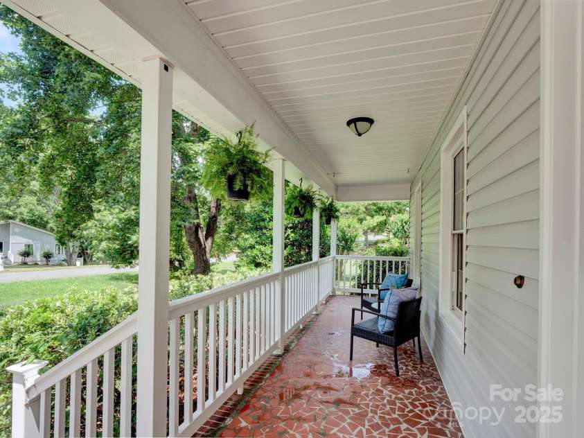 8301 Tifton Road, Charlotte, NC 28226.  MLS# CAR4275465, YatesRealty ID 29738. Rocking chair front porc