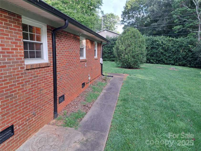 123 Softwind Lane, Concord, NC 28025.  MLS# CAR4296194, YatesRealty ID 2974. Back of house (to left)