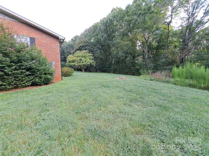 123 Softwind Lane, Concord, NC 28025.  MLS# CAR4296194, YatesRealty ID 2974. Side Yard