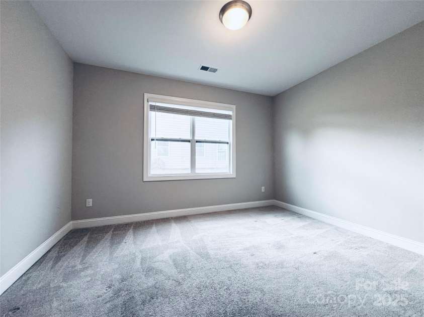 8310 Sandstone Crest Lane, Indian Land, SC 29707.  MLS# CAR4232992, YatesRealty ID 29744. BEDROOM / DOWNSTAIRS