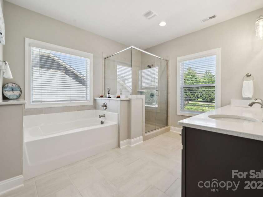 8310 Sandstone Crest Lane, Indian Land, SC 29707.  MLS# CAR4232992, YatesRealty ID 29744. MAIN BATHROOM: Shower, bathtub and double sink