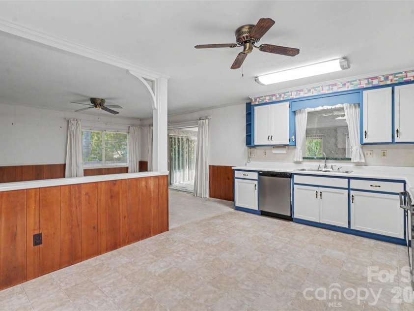 328 Brookwood Drive, Salisbury, NC 28146.  MLS# CAR4418721, YatesRealty ID 29759. Kitchen with window looking into sunroom