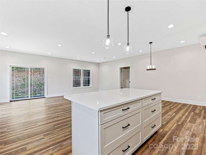 297 Bethany Drive, Mars Hill, NC 28754.  MLS# CAR4277821, YatesRealty ID 2976. Kitchen Island Offers Additional Storage - Quartz Counters - Open Floorplan