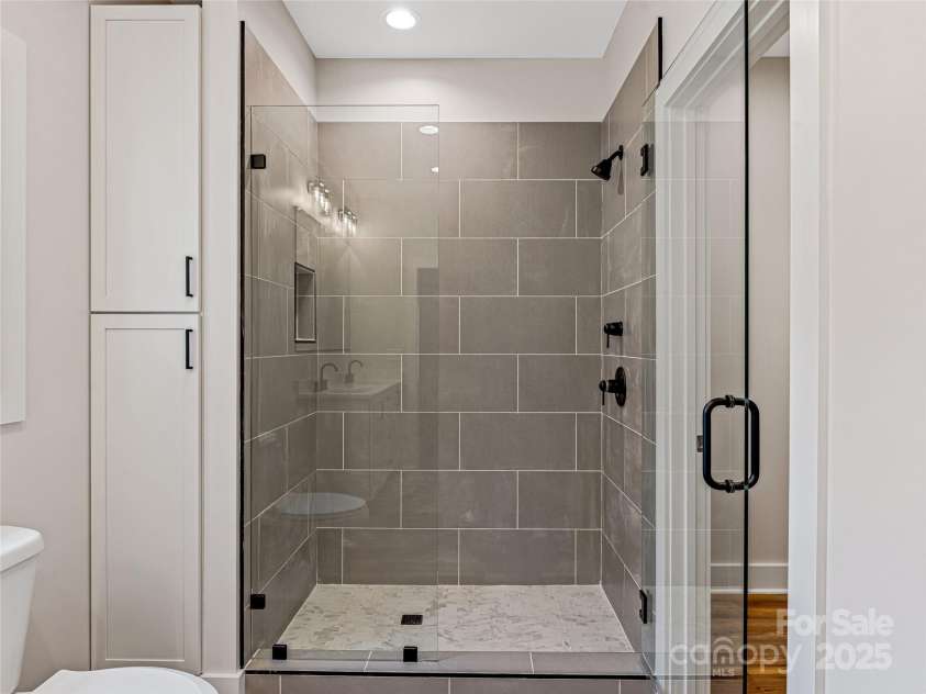 297 Bethany Drive, Mars Hill, NC 28754.  MLS# CAR4277821, YatesRealty ID 2976. Primary Bathroom Shower - Custom Glass Enclosure - Tile Surround