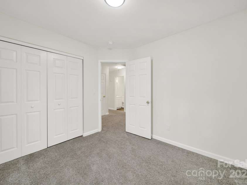 7801 Bella Vista Court, Charlotte, NC 28216.  MLS# CAR4285247, YatesRealty ID 29767. Another view of Bedroom 2 leading to the hallway.