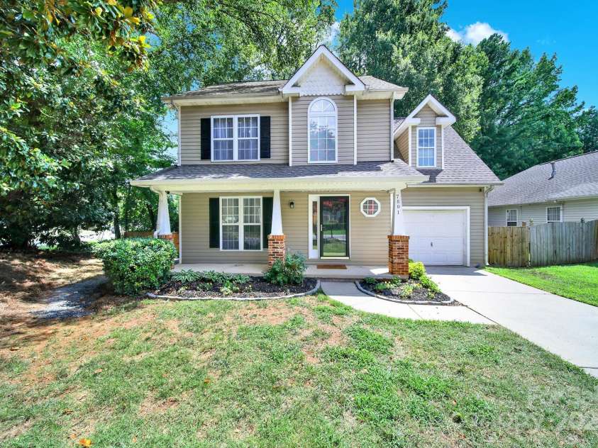 7801 Bella Vista Court, Charlotte, NC 28216.  MLS# CAR4285247, YatesRealty ID 29767. Another view of the home showing the wonderful curb appeal and long driveway.
