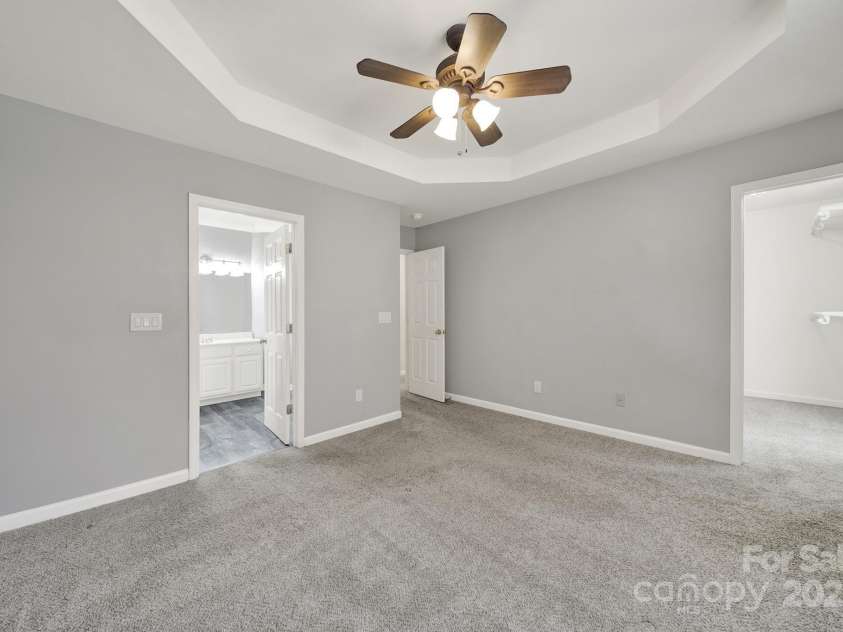 7801 Bella Vista Court, Charlotte, NC 28216.  MLS# CAR4285247, YatesRealty ID 29767. Another view of the Primary Bedroom showing view into bath and LARGE closet.