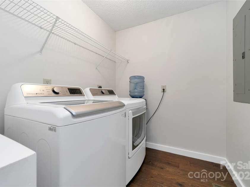 557 Country Club Estates Drive, Sapphire, NC 28774.  MLS# CAR4302980, YatesRealty ID 2977. Laundry room is neat and clean, and the appliances convey with the house.