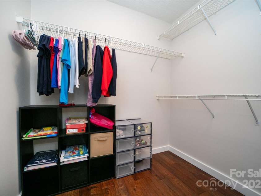 557 Country Club Estates Drive, Sapphire, NC 28774.  MLS# CAR4302980, YatesRealty ID 2977. The walk-in closet in the front, 2nd, bedroom.