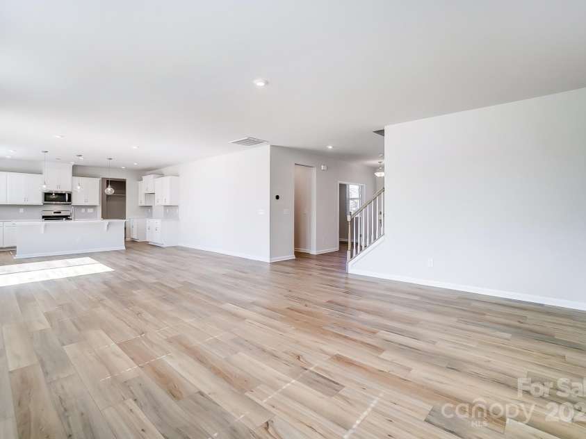 2505 Crimson Way, Monroe, NC 28112.  MLS# CAR4279959, YatesRealty ID 29780. Representative great room/kitchen area