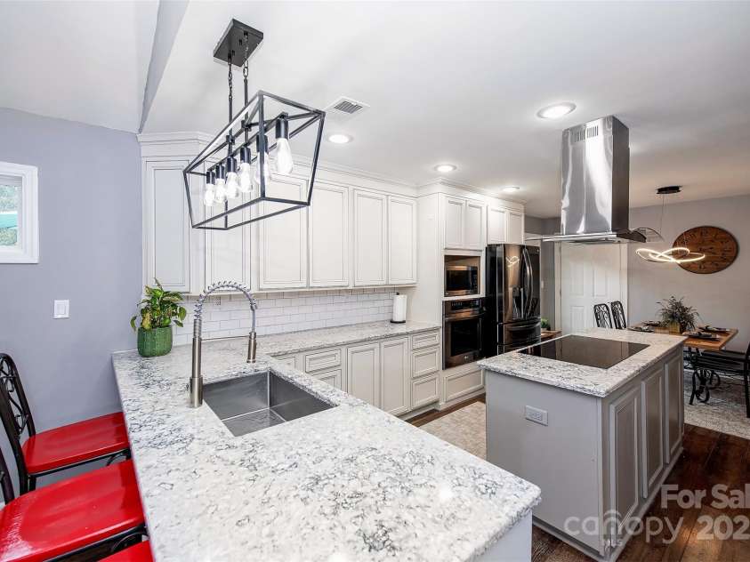 16065 Taku Court, Tega Cay, SC 29708.  MLS# CAR4284887, YatesRealty ID 29782. Kitchen from Den