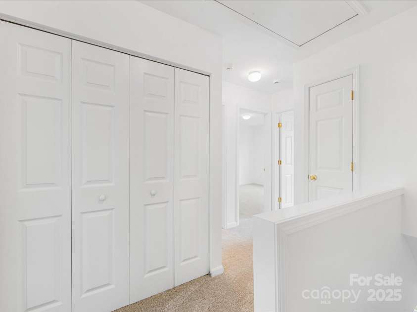 6913 Rothchild Drive, Charlotte, NC 28270.  MLS# CAR4278243, YatesRealty ID 29783. Laundry Closet in upstairs hallway