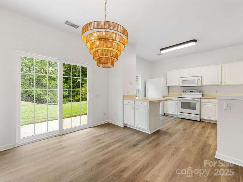 6913 Rothchild Drive, Charlotte, NC 28270.  MLS# CAR4278243, YatesRealty ID 29783. New light fixture in dining area
