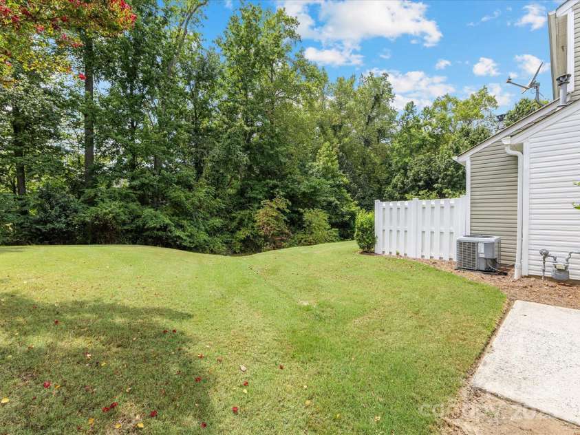 6913 Rothchild Drive, Charlotte, NC 28270.  MLS# CAR4278243, YatesRealty ID 29783. Wooded area behind