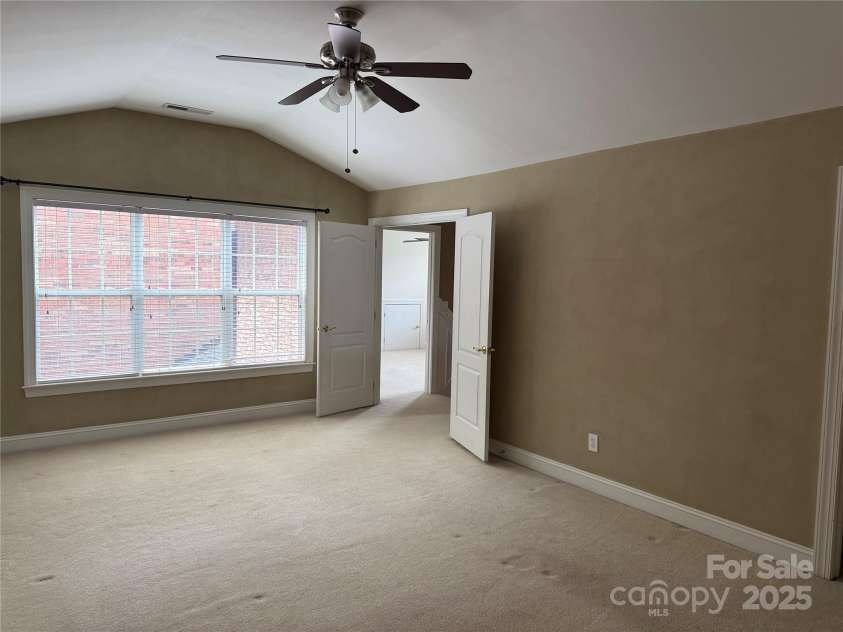 9177 Bonnie Briar Circle, Charlotte, NC 28277.  MLS# CAR4267852, YatesRealty ID 29784. Large Primary has wall of windows for natural light
