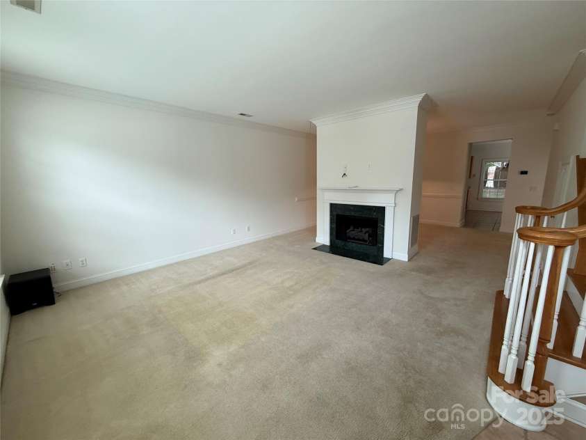 9177 Bonnie Briar Circle, Charlotte, NC 28277.  MLS# CAR4267852, YatesRealty ID 29784. Living room w/ fireplace & gas logs