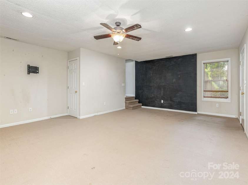 39 Apple Creek Lane, Hendersonville, NC 28792.  MLS# CAR4171791, YatesRealty ID 2979. Downstairs Flex Room With Window