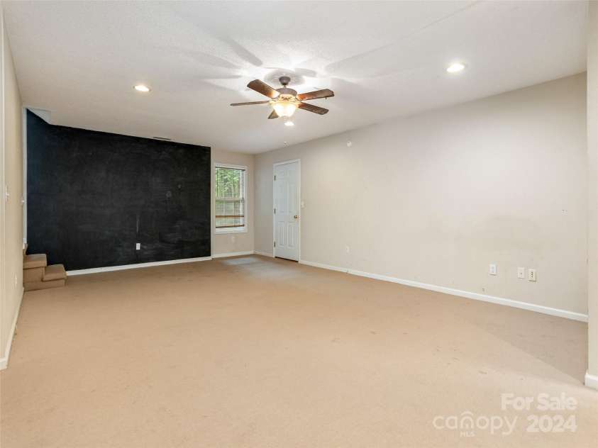 39 Apple Creek Lane, Hendersonville, NC 28792.  MLS# CAR4171791, YatesRealty ID 2979. Large Downstairs Flex Room