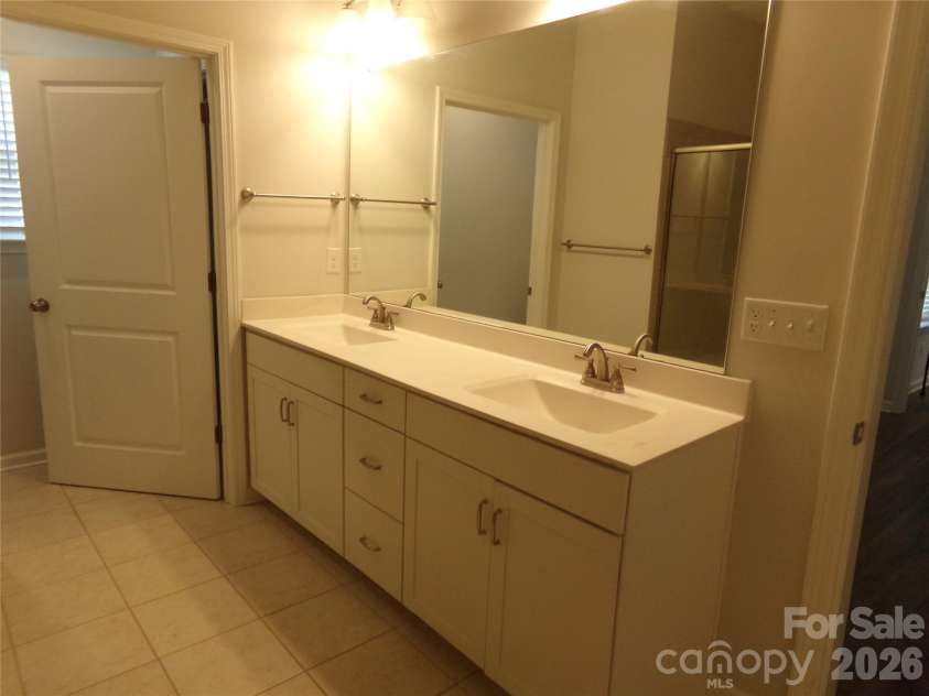 517 Ardsley Drive, Locust, NC 28097.  MLS# CAR4392653, YatesRealty ID 29798. Master bath