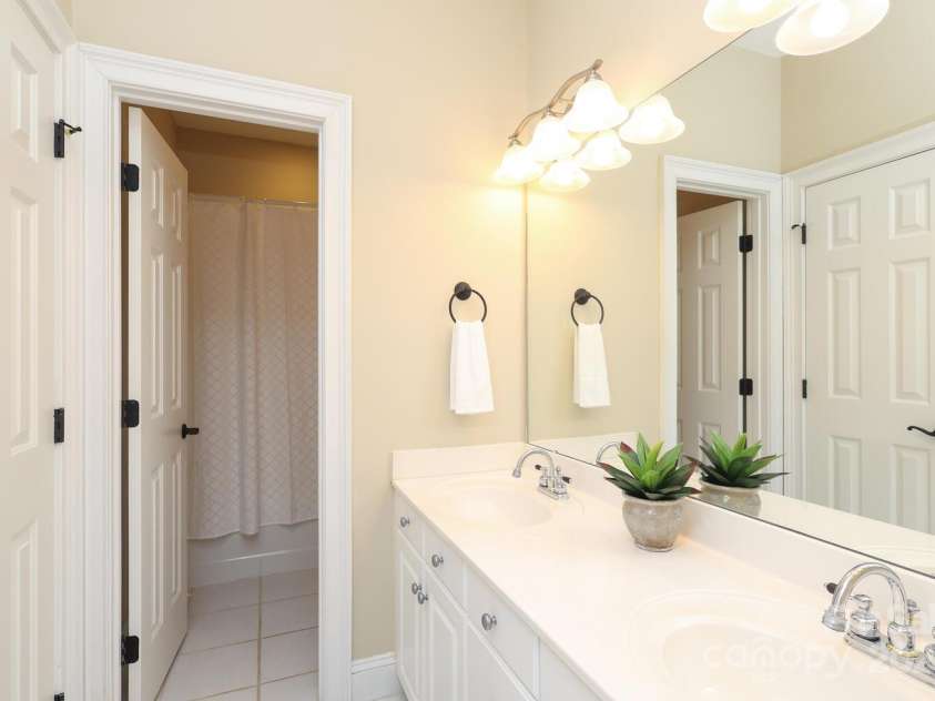 10840 Congressional Club Drive, Charlotte, NC 28277.  MLS# CAR4286308, YatesRealty ID 29804. Upstairs bedroom wi th cathedral ceiling