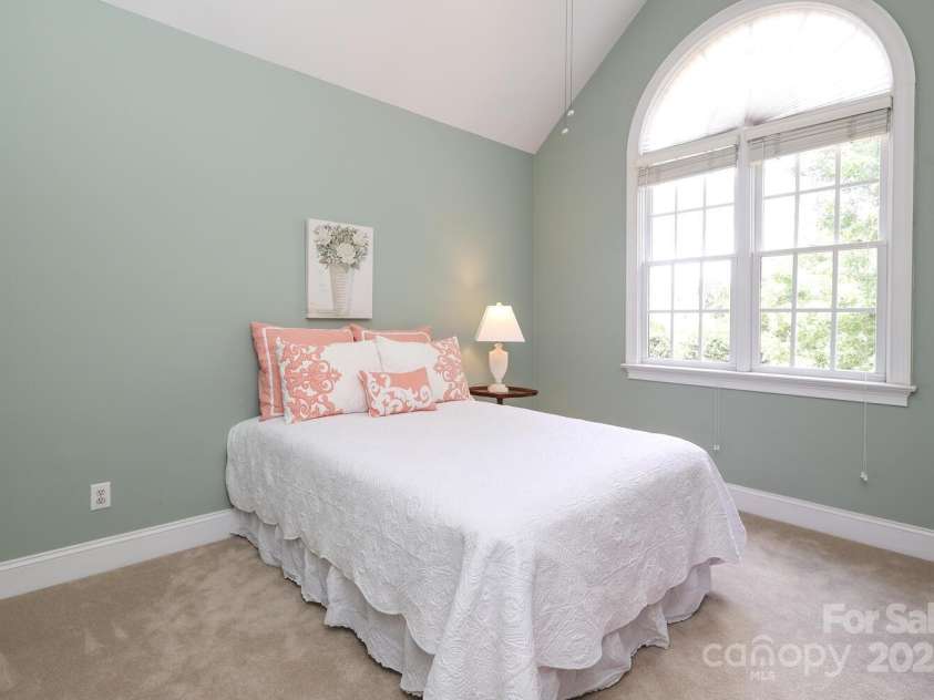 10840 Congressional Club Drive, Charlotte, NC 28277.  MLS# CAR4286308, YatesRealty ID 29804. Upstairs bedroom wi th cathedral ceiling