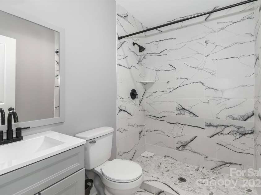 6310 Forney Hill Road, Denver, NC 28037.  MLS# CAR4270228, YatesRealty ID 29815. Bathroom with new vanity and tile.