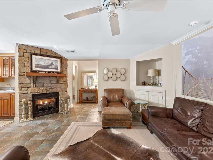 20601 Autumn Breeze Court, Cornelius, NC 28031.  MLS# CAR4284173, YatesRealty ID 29825. Basement Living Area with Gas Fireplace