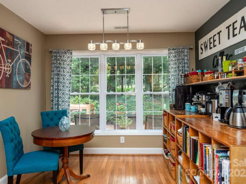 136 Fawn Lane, Roaring Gap, NC 28668.  MLS# CAR4285140, YatesRealty ID 29838. Breakfast area overlooking the beautiful garden