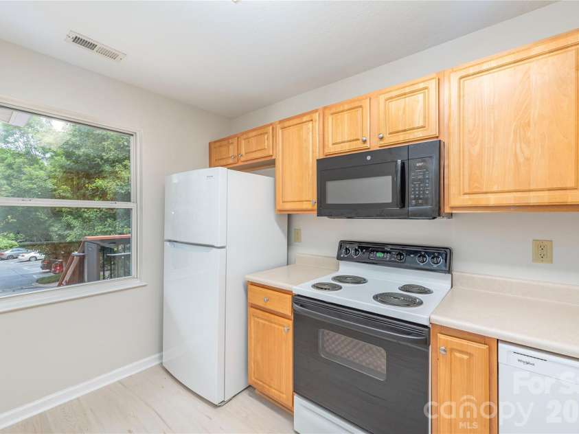 409 Carlyle Way, Asheville, NC 28803.  MLS# CAR4392265, YatesRealty ID 29842. Bright Kitchen--New Frig
