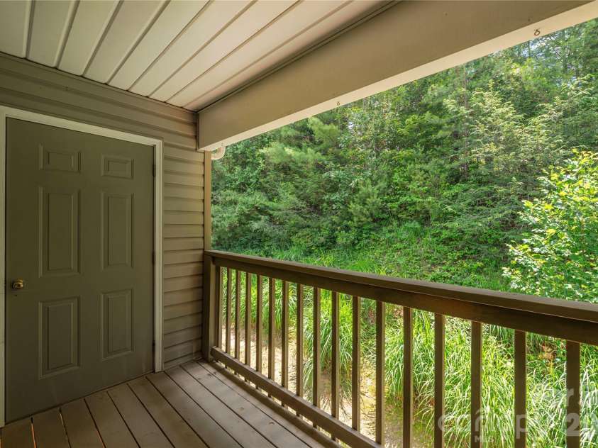 409 Carlyle Way, Asheville, NC 28803.  MLS# CAR4392265, YatesRealty ID 29842. Private Rear Deck with Storage Closet