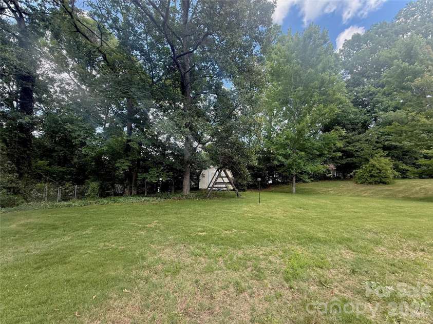 303 Cavin Avenue, Mount Holly, NC 28120.  MLS# CAR4392720, YatesRealty ID 29846. Backyard