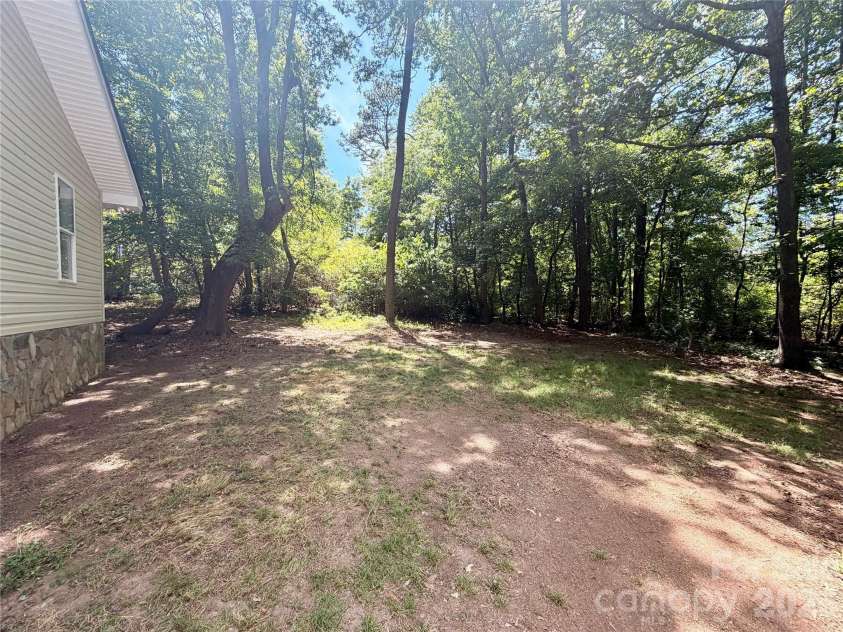 3910 Oakwood Circle, Iron Station, NC 28080.  MLS# CAR4378184, YatesRealty ID 29859. Backyard