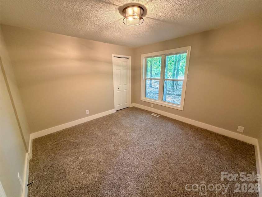 3910 Oakwood Circle, Iron Station, NC 28080.  MLS# CAR4378184, YatesRealty ID 29859. Bed 2
